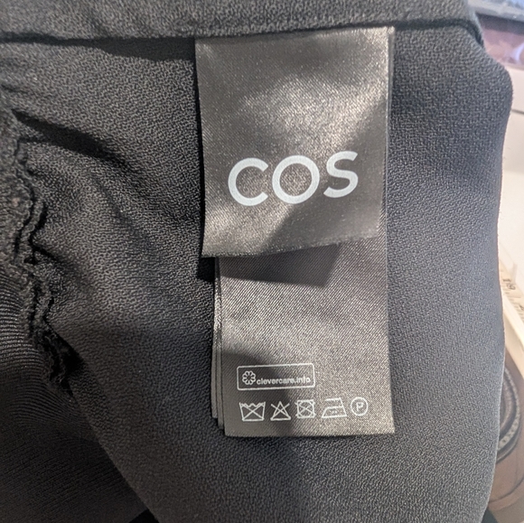 COS | Power-shoulder Open-back Waisted Wool Top In Black - Picture 13 of 15